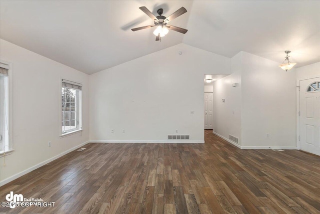 interior space featuring dark wood-type flooring, ceiling fan, and lofted ceiling