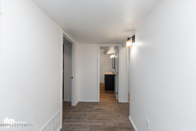 corridor with dark wood-type flooring