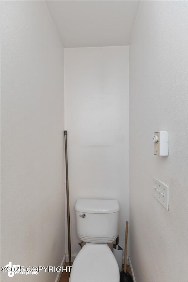 bathroom featuring toilet