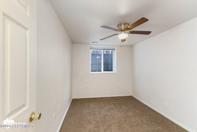 carpeted empty room with ceiling fan