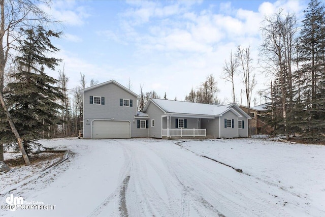 view of front of home with a garage and covered porch