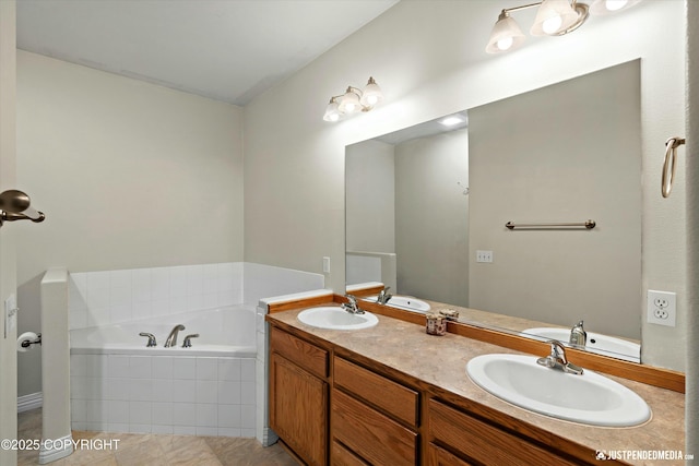 bathroom featuring a garden tub, double vanity, and a sink