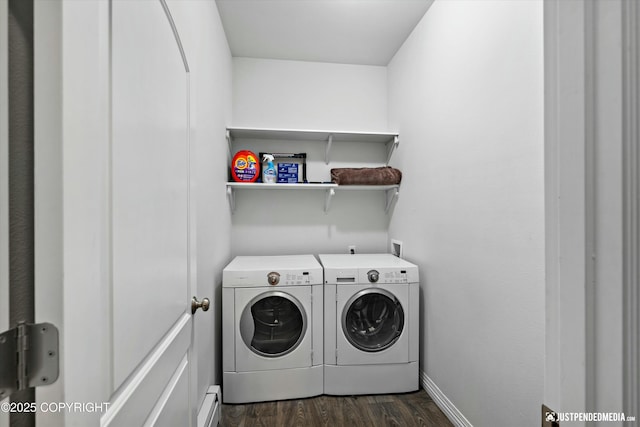 laundry area with laundry area, separate washer and dryer, dark wood-type flooring, baseboards, and baseboard heating