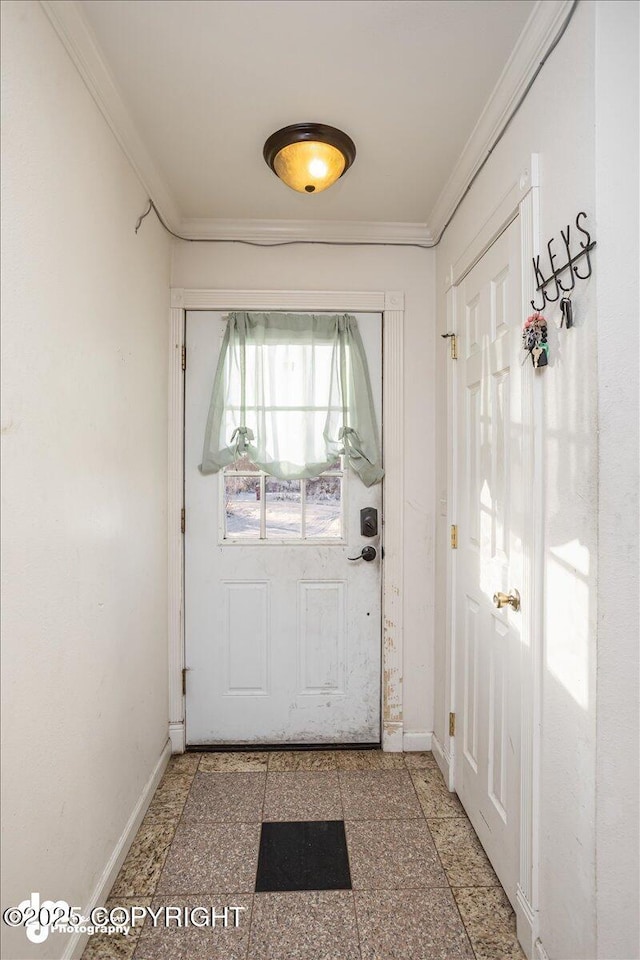 entryway featuring crown molding