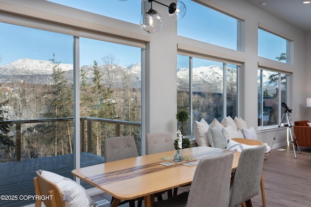 sunroom with a mountain view