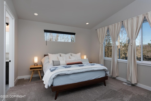 bedroom featuring vaulted ceiling and carpet flooring