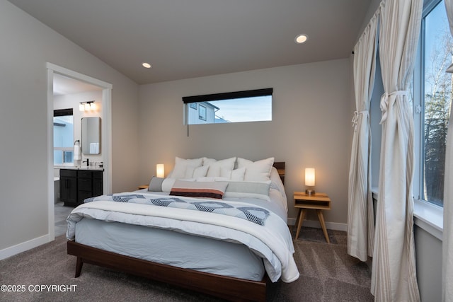 bedroom featuring sink, carpet flooring, and connected bathroom