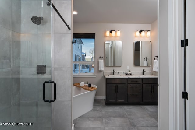 bathroom featuring vanity and independent shower and bath