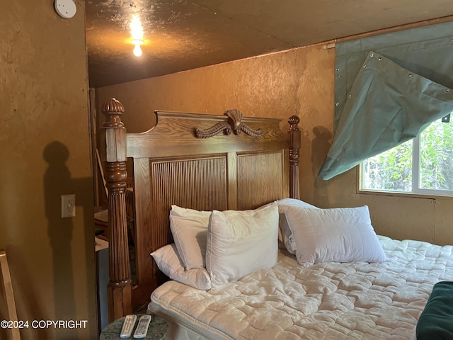 bedroom featuring vaulted ceiling