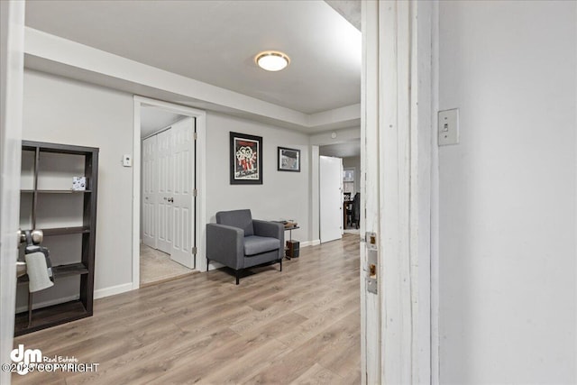 sitting room with light hardwood / wood-style floors