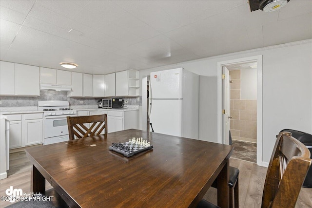 dining room featuring light hardwood / wood-style floors