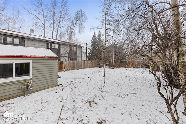 view of yard layered in snow