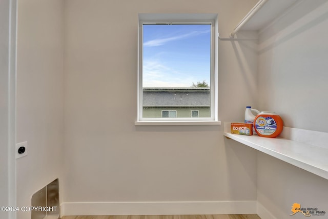 clothes washing area with electric dryer hookup