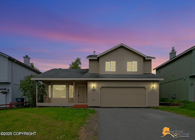 7541 Florence Cir, Anchorage, AK 99507 - traditional home featuring driveway, an attached garage, and a front lawn