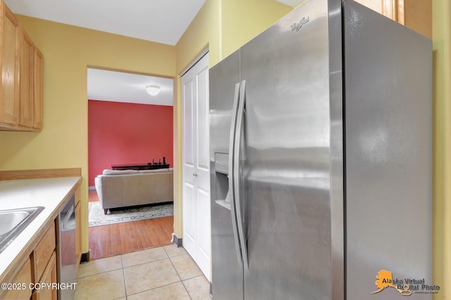 7541 Florence Cir, Anchorage, AK 99507 - kitchen with appliances with stainless steel finishes, light countertops, and light tile patterned floors