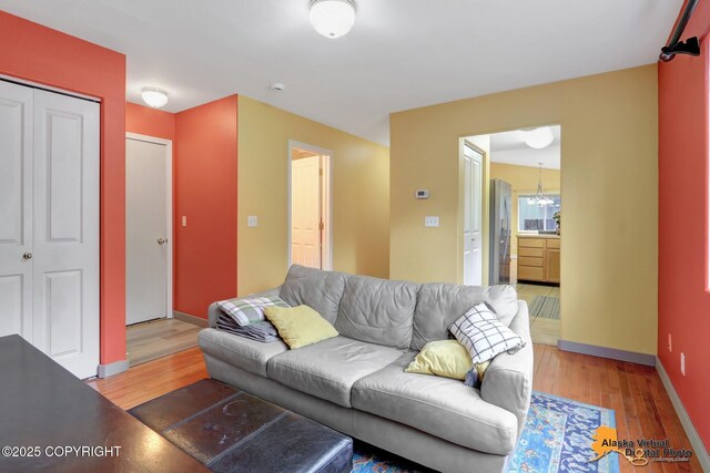 7541 Florence Cir, Anchorage, AK 99507 - living room featuring light wood-type flooring and baseboards