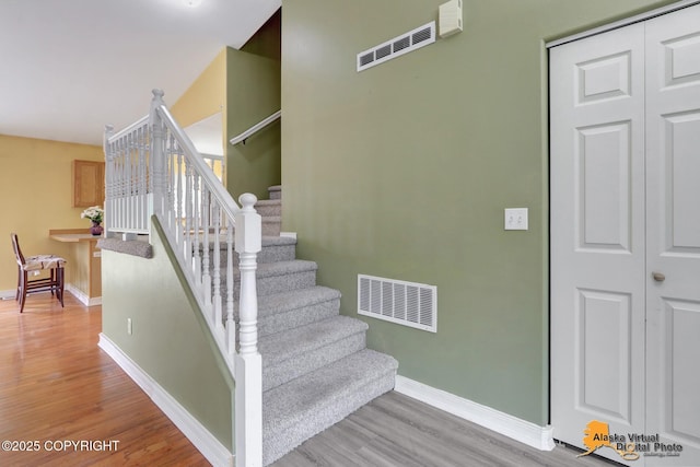 7541 Florence Cir, Anchorage, AK 99507 - staircase featuring wood finished floors and baseboards