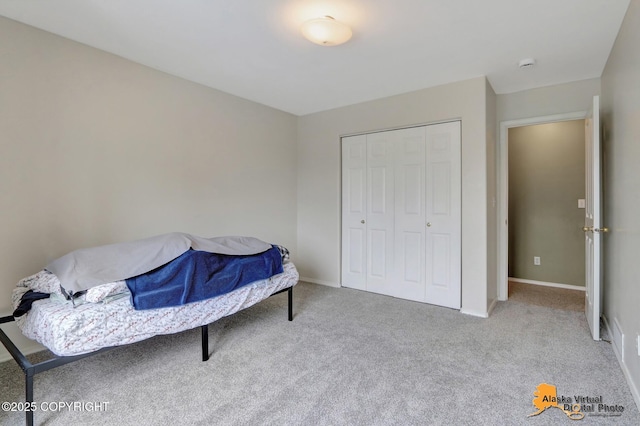 7541 Florence Cir, Anchorage, AK 99507 - bedroom with carpet floors, a closet, and baseboards