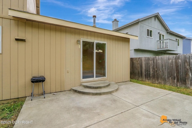 7541 Florence Cir, Anchorage, AK 99507 - rear view of property featuring a patio area and a chimney