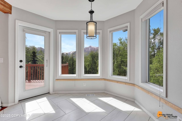 10235 Stewart Dr, Eagle River, AK 99577 - unfurnished dining area with baseboards and light tile patterned flooring
