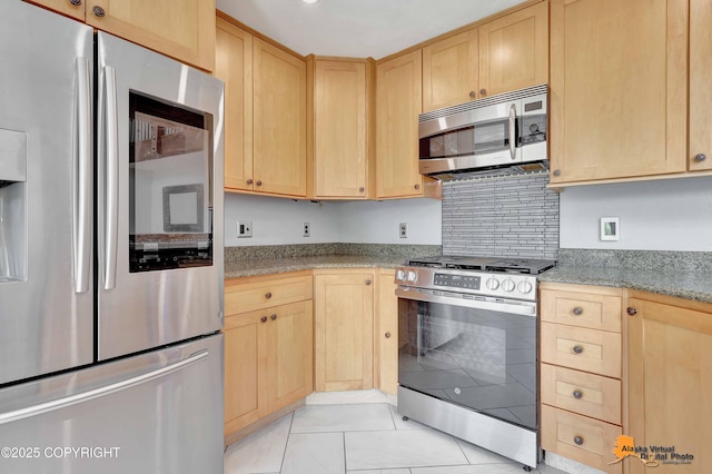 10235 Stewart Dr, Eagle River, AK 99577 - kitchen with appliances with stainless steel finishes, light brown cabinets, light tile patterned flooring, and light stone counters