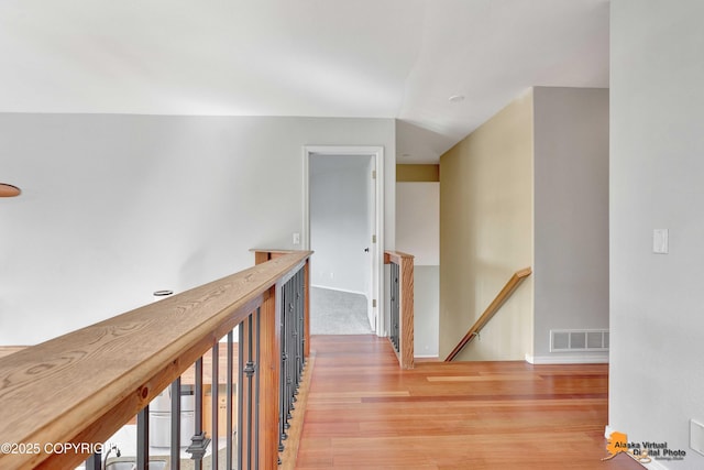 10235 Stewart Dr, Eagle River, AK 99577 - hall featuring an upstairs landing and light wood-style floors