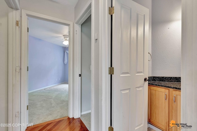 10235 Stewart Dr, Eagle River, AK 99577 - hall with light wood-style floors and light colored carpet