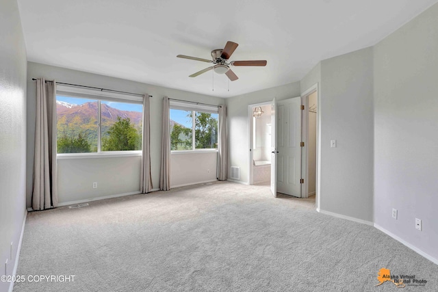 10235 Stewart Dr, Eagle River, AK 99577 - empty room featuring carpet and ceiling fan