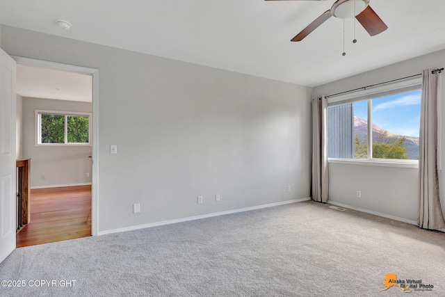 10235 Stewart Dr, Eagle River, AK 99577 - unfurnished room with carpet, a ceiling fan, and a smoke detector