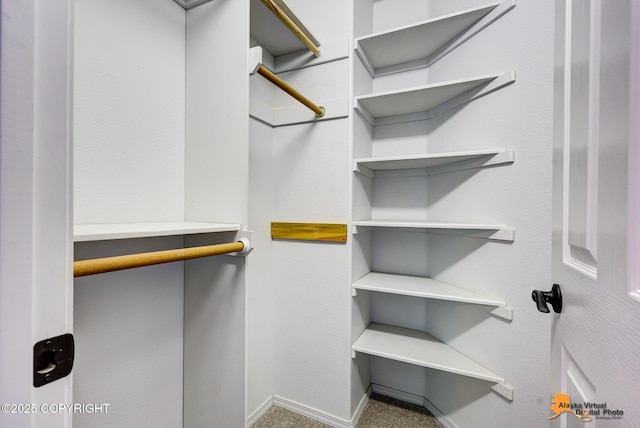 10235 Stewart Dr, Eagle River, AK 99577 - walk in closet featuring carpet
