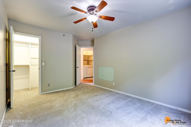 10235 Stewart Dr, Eagle River, AK 99577 - unfurnished bedroom featuring washer / clothes dryer, carpet flooring, a walk in closet, ceiling fan, and a closet