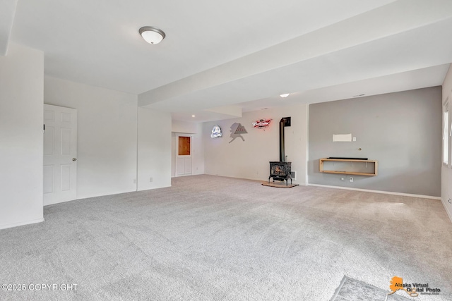 10235 Stewart Dr, Eagle River, AK 99577 - unfurnished living room with a wood stove and carpet floors