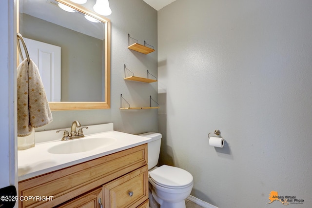 10235 Stewart Dr, Eagle River, AK 99577 - bathroom featuring vanity and toilet