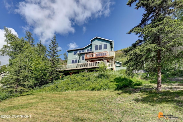 10235 Stewart Dr, Eagle River, AK 99577 - rear view of house with a yard and a wooden deck