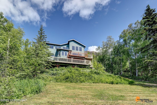 10235 Stewart Dr, Eagle River, AK 99577 - back of property with a deck and a yard