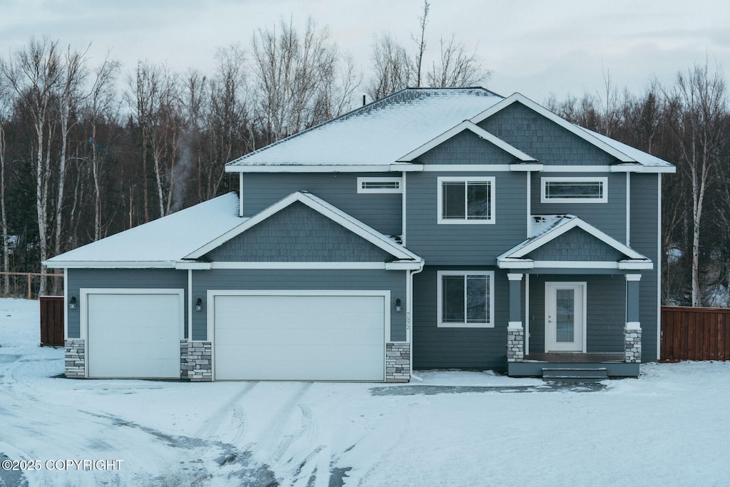 craftsman house with a garage