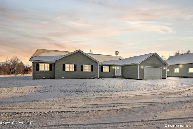 ranch-style house featuring a garage