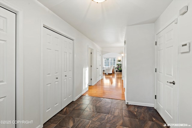 hall with dark hardwood / wood-style flooring