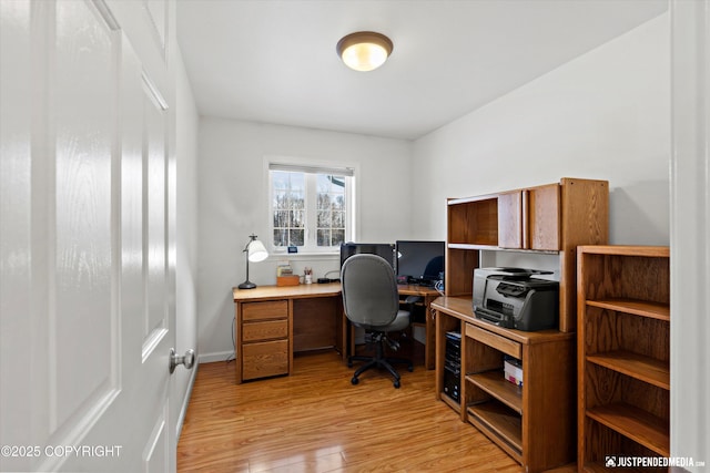 office with light hardwood / wood-style floors