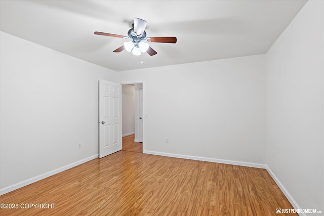 spare room featuring ceiling fan and light hardwood / wood-style flooring