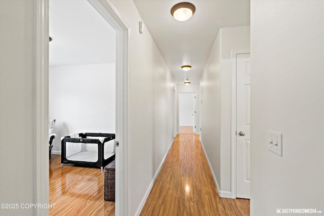 hallway with wood-type flooring