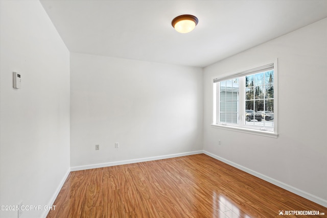 unfurnished room featuring light hardwood / wood-style floors