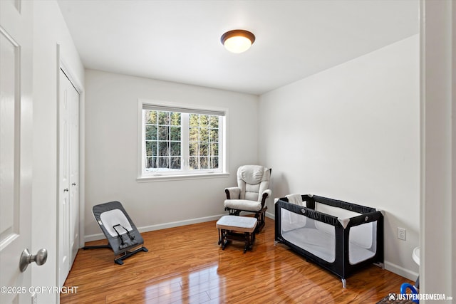 sitting room with hardwood / wood-style floors