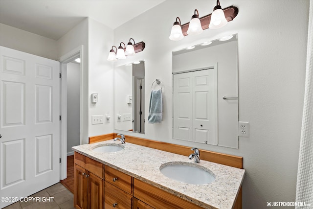 bathroom featuring tile patterned floors and vanity