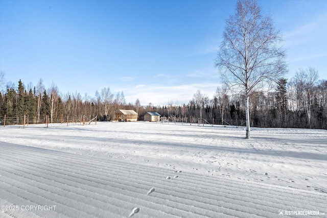 view of yard layered in snow