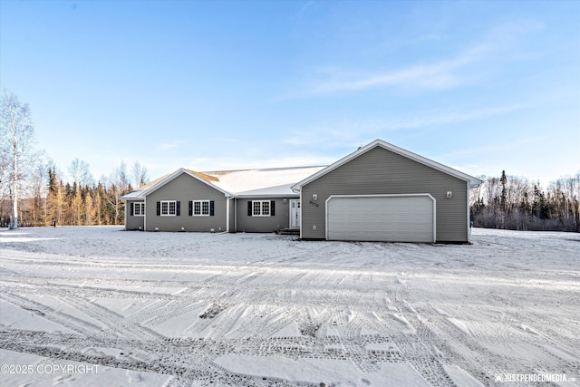 ranch-style home featuring a garage