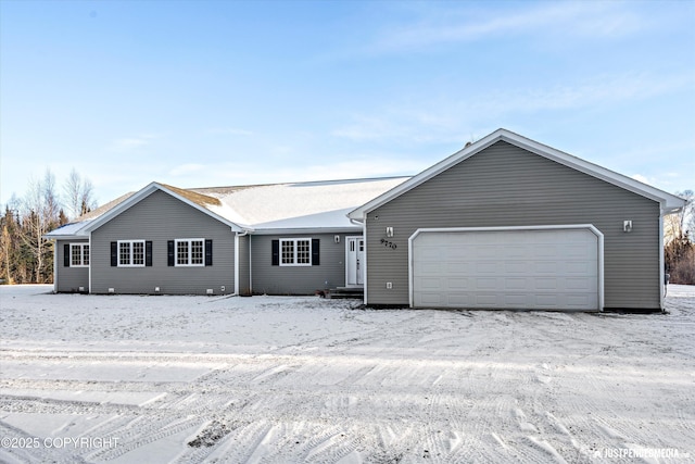 single story home featuring a garage