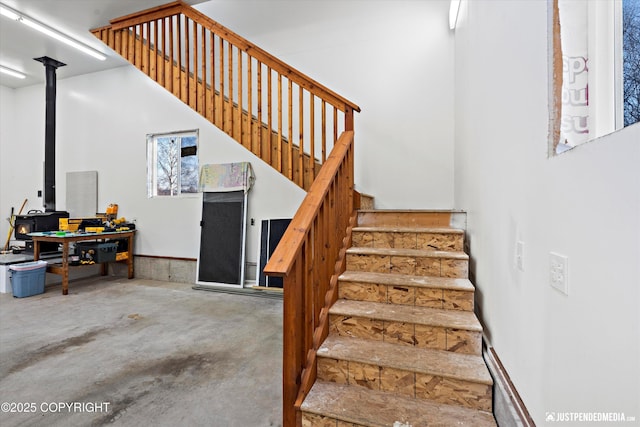 staircase with concrete floors