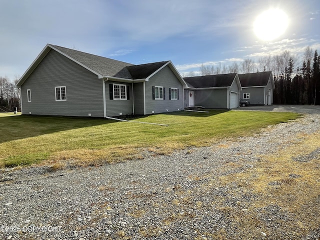 view of front of home with a garage and a front lawn