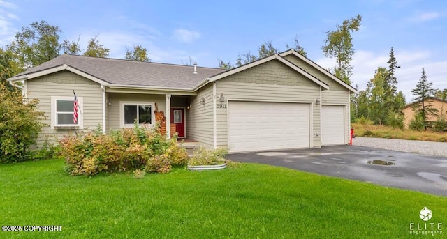 ranch-style house featuring a garage and a front lawn